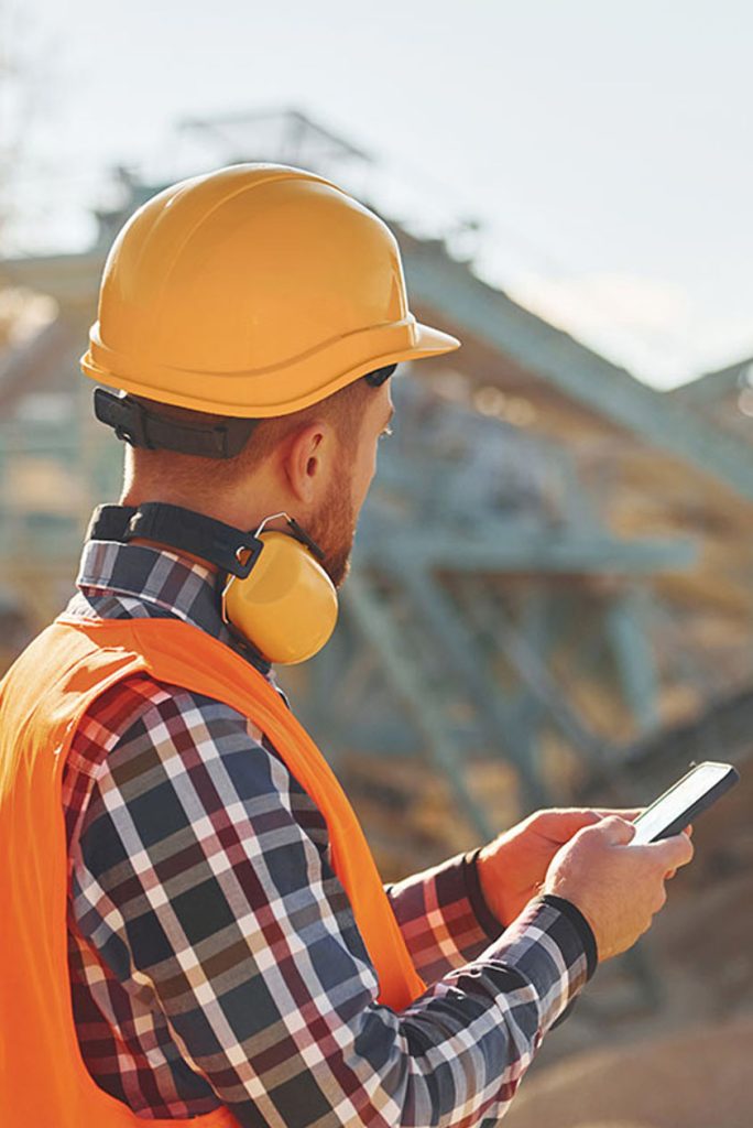 AN ENGINEER WORKING ON SITE